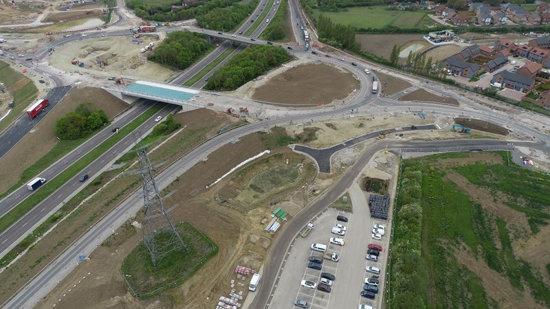 An aerial shot of a road showing a big roundabout.