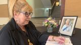 KCC Chair signing the book of condolence in the County Hall