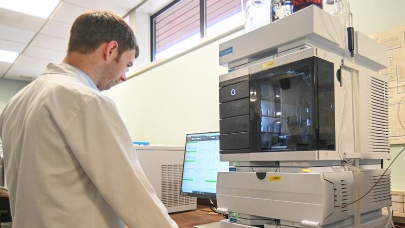 A senior scientific officer at Kent Scientific Services at work on the testing equipment.