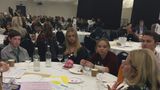 Image of young students around a table at the Big Conversation meet up discussing the day