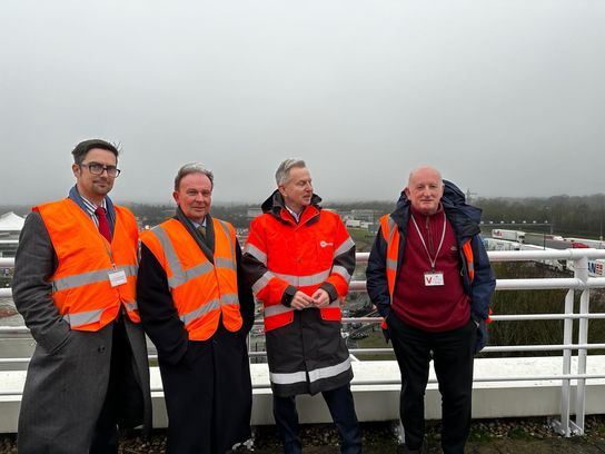 From left to right, KCC Cabinet Member for Highways and Transport Neil Baker, KCC Leader Roger Gough, Eurotunnel spokesman John Keefe and KCC Cabinet Member for Economic Development Derek Murphy, all in orange hi-vis jackets, look over the Eurotunnel site and the work being done to help mitigate the impact of new border checks coming in later this year