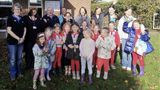 Children from Vinters Rainbows Guides standing in a group with volunteers from Allington Library
