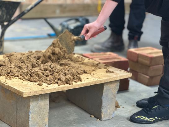 SALT college construction demo with bricks and mortar